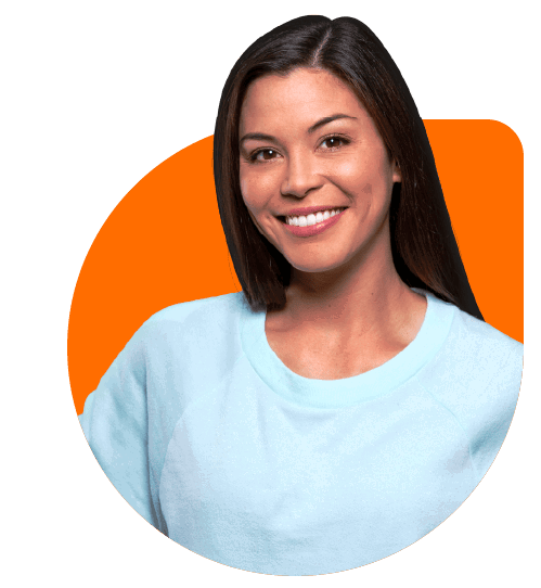 A woman with long brown hair smiles while wearing a light blue sweatshirt, representing the APAC Talent Hub