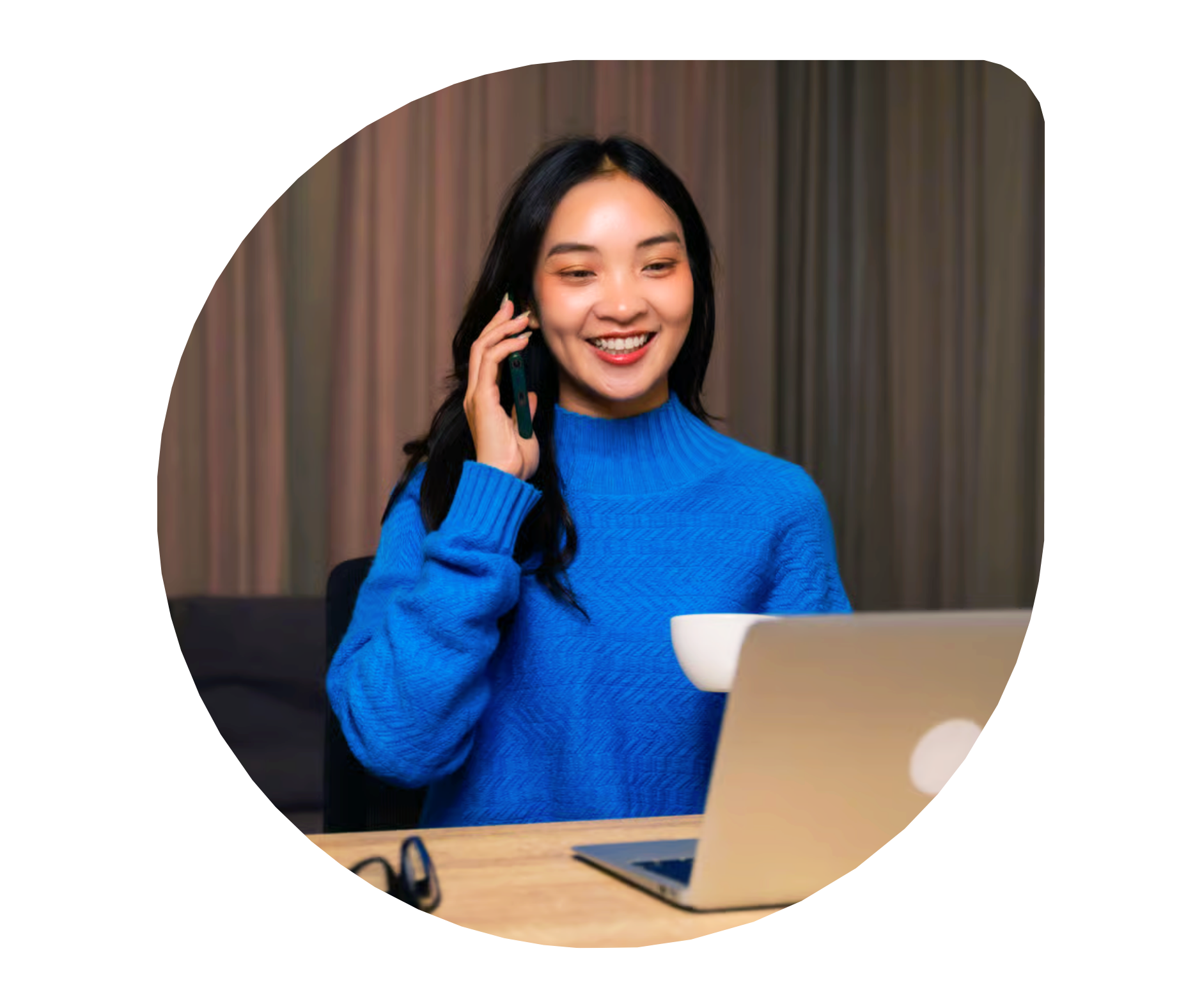A MyOutDesk virtual assistant on a call, working at her laptop
